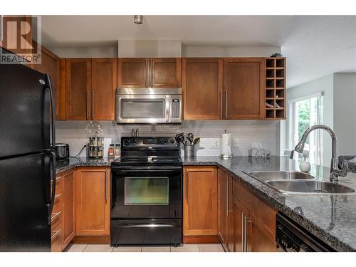 1093 Sunset Drive Unit# 105, Kelowna, BC - Indoor Photo Showing Kitchen With Double Sink