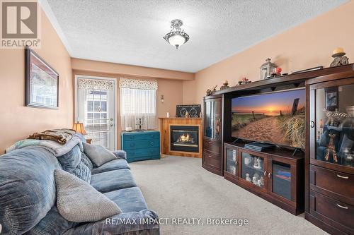 #Lower -39 Marchwood Cres, Clarington, ON - Indoor Photo Showing Living Room With Fireplace