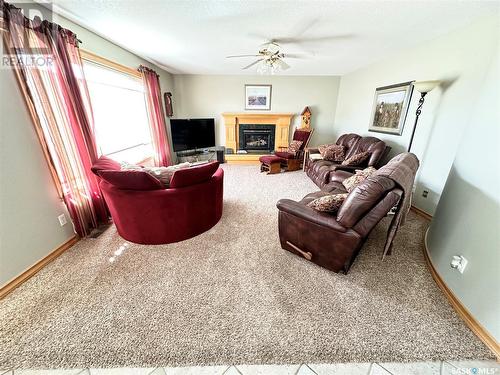 10 Porter Bay, Weyburn, SK - Indoor Photo Showing Living Room With Fireplace