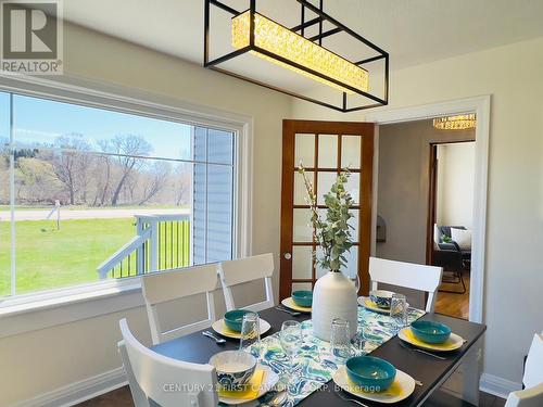 Diningroom leading through doors to the Livingroom - 4025 Union Road, Central Elgin (Port Stanley), ON - Indoor Photo Showing Dining Room