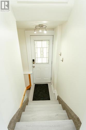 Back door to back patio and stairs to lower level - 4025 Union Road, Central Elgin (Port Stanley), ON - Indoor Photo Showing Other Room