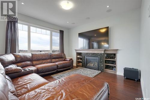 7510 Lilac Place, Regina, SK - Indoor Photo Showing Living Room With Fireplace