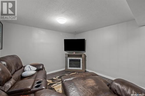1117 7Th Street E, Prince Albert, SK - Indoor Photo Showing Living Room With Fireplace