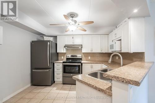 #112 -3499 Upper Middle Rd, Burlington, ON - Indoor Photo Showing Kitchen With Double Sink
