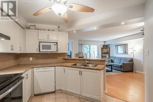 112 - 3499 Upper Middle Road, Burlington, ON - Indoor Photo Showing Kitchen With Double Sink