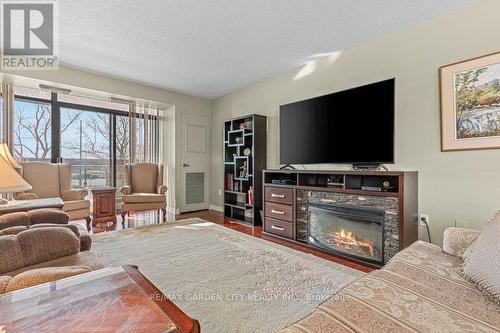 203 - 301 Frances Avenue, Hamilton, ON - Indoor Photo Showing Living Room With Fireplace