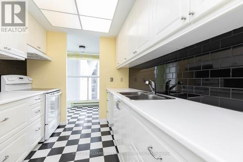 608 - 77 Harbour Square, Toronto, ON - Indoor Photo Showing Kitchen With Double Sink