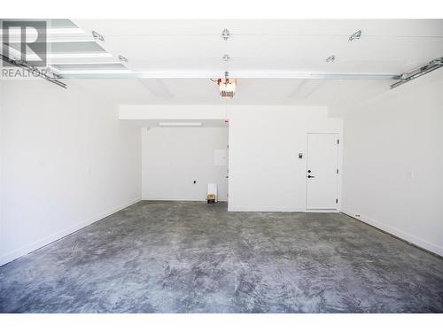 610 Academy Way Unit# 114, Kelowna, BC - Indoor Photo Showing Garage