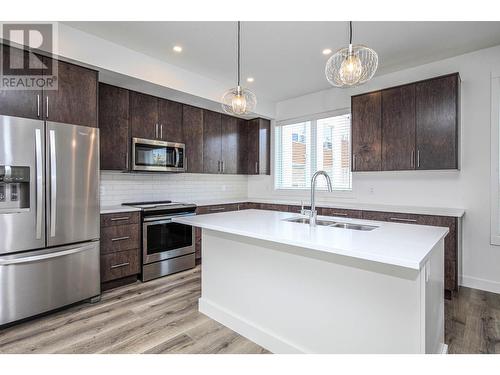 610 Academy Way Unit# 123, Kelowna, BC - Indoor Photo Showing Kitchen With Double Sink