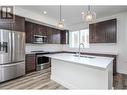 610 Academy Way Unit# 123, Kelowna, BC  - Indoor Photo Showing Kitchen With Double Sink 