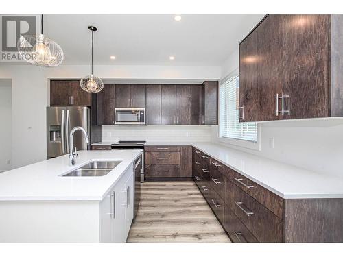 610 Academy Way Unit# 123, Kelowna, BC - Indoor Photo Showing Kitchen With Double Sink With Upgraded Kitchen