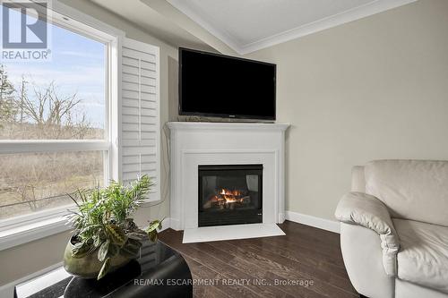 #10 -2151 Walkers Line, Burlington, ON - Indoor Photo Showing Living Room With Fireplace