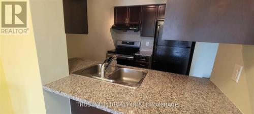 #608 -60 Town Centre Crt, Toronto, ON - Indoor Photo Showing Kitchen With Double Sink