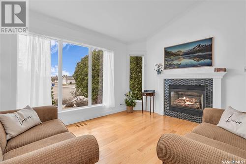 739 Emerald Bay, Saskatoon, SK - Indoor Photo Showing Living Room With Fireplace