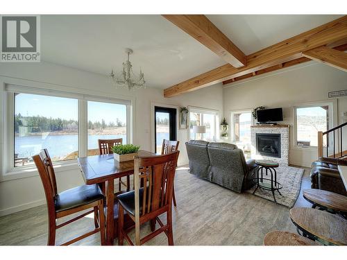 3112 Doctors Lake Road, 150 Mile House, BC - Indoor Photo Showing Dining Room With Fireplace