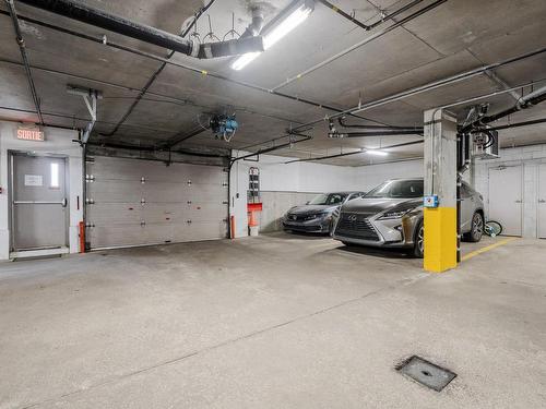Parking - 401-150 Rue Barnett, Dollard-Des-Ormeaux, QC - Indoor Photo Showing Garage