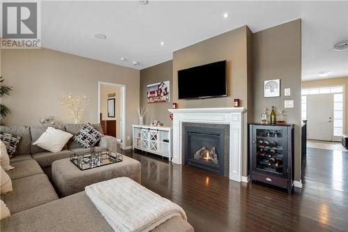 Cozy up to a warm gas fireplace in the living room - 111 Antler Court, Almonte, ON - Indoor Photo Showing Living Room With Fireplace
