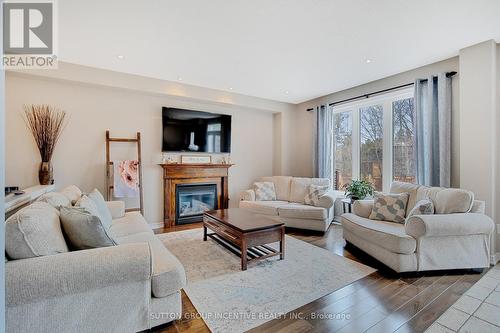 920 Booth Ave, Innisfil, ON - Indoor Photo Showing Living Room With Fireplace