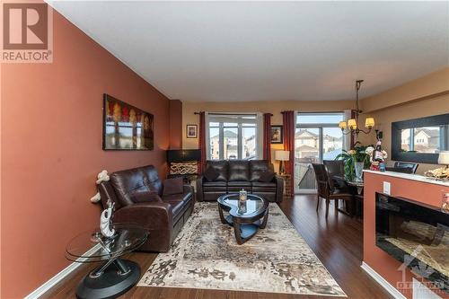 1436 Comfrey Circle, Ottawa, ON - Indoor Photo Showing Living Room With Fireplace