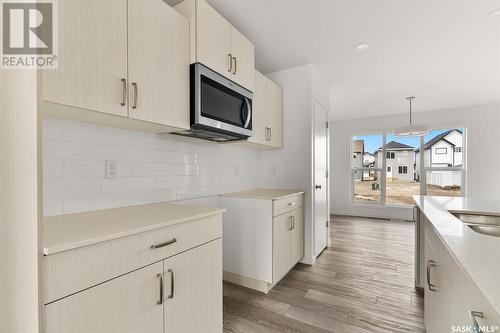 3058 Bellegarde Crescent, Regina, SK - Indoor Photo Showing Kitchen With Double Sink