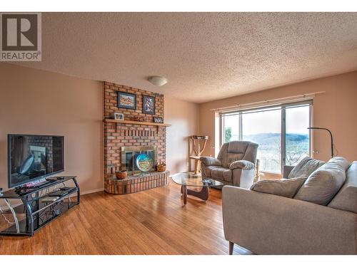 6945 Rugg Road, Vernon, BC - Indoor Photo Showing Living Room With Fireplace