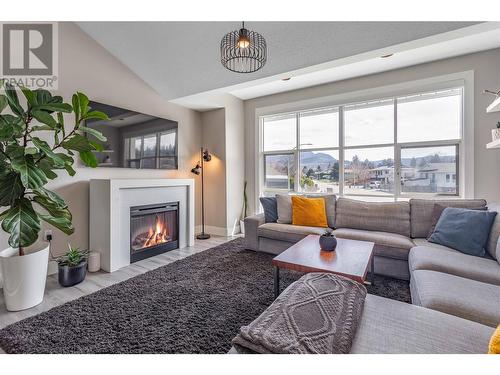 1720 Simpson Court, Kelowna, BC - Indoor Photo Showing Living Room With Fireplace