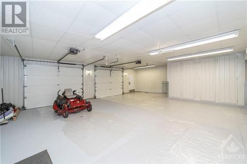 oversized double garage - 6780 Pilon Point Road, Summerstown, ON - Indoor Photo Showing Garage