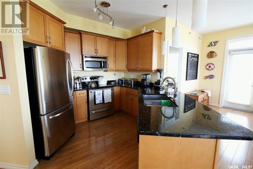 303 2160 Heseltine Road, Regina, SK - Indoor Photo Showing Kitchen With Stainless Steel Kitchen With Double Sink