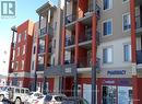 1405 - 403 Mackenzie Way Sw, Airdrie, AB  - Outdoor With Balcony With Facade 