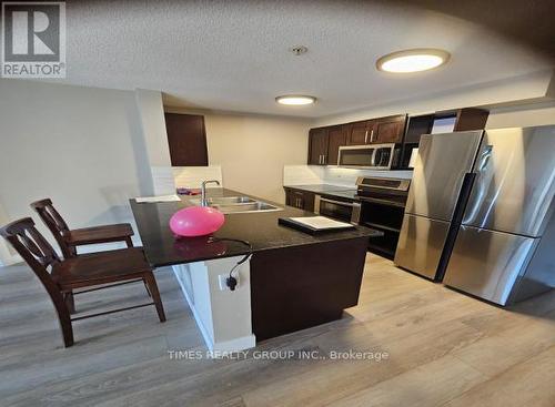 1405 - 403 Mackenzie Way Sw, Airdrie, AB - Indoor Photo Showing Kitchen With Double Sink