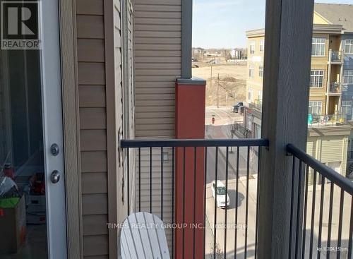 1405 - 403 Mackenzie Way Sw, Airdrie, AB - Outdoor With Balcony With Exterior
