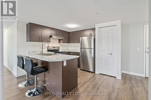 #413 -7 Kay Cres, Guelph, ON - Indoor Photo Showing Kitchen With Stainless Steel Kitchen With Double Sink