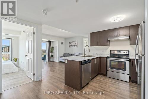 #413 -7 Kay Cres, Guelph, ON - Indoor Photo Showing Kitchen With Stainless Steel Kitchen