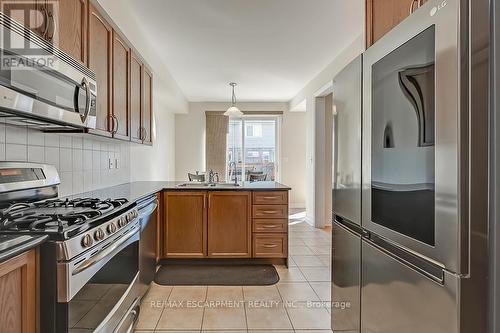#43 -2019 Trawden Way, Oakville, ON - Indoor Photo Showing Kitchen With Stainless Steel Kitchen With Double Sink