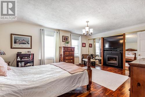 152 Confederation Street, Halton Hills, ON - Indoor Photo Showing Bedroom With Fireplace