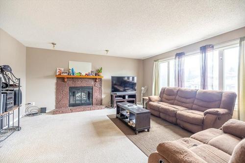 1235 Pinyon Road, Sparwood, BC - Indoor Photo Showing Living Room With Fireplace