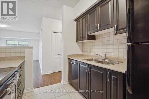 #408 -45 Ferndale Dr S, Barrie, ON - Indoor Photo Showing Kitchen With Double Sink