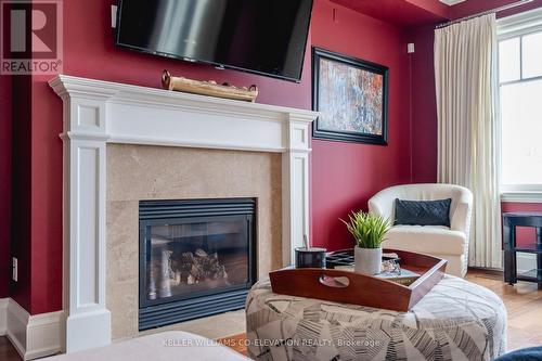 701 - 40 Trott Boulevard, Collingwood, ON - Indoor Photo Showing Living Room With Fireplace