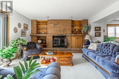 219 Benesh Crescent, Saskatoon, SK - Indoor Photo Showing Living Room With Fireplace