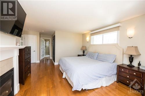 7350 Franktown Road, Ottawa, ON - Indoor Photo Showing Bedroom With Fireplace
