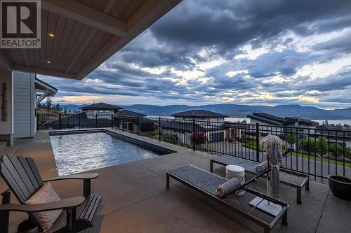 5670 Mountainside Court, Kelowna, BC - Outdoor With In Ground Pool With Deck Patio Veranda With View