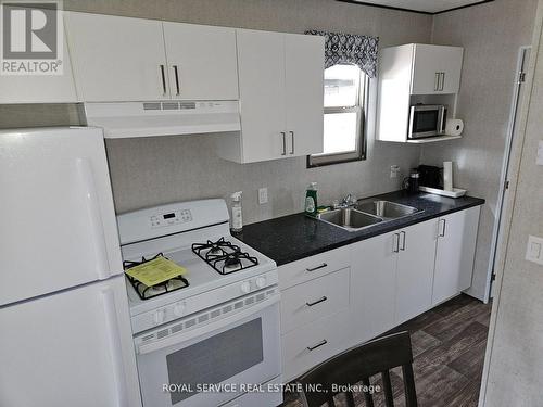 626 - 7100 County Road 18, Alnwick/Haldimand, ON - Indoor Photo Showing Kitchen With Double Sink