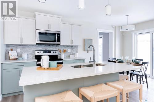 230 Schmeiser Bend, Saskatoon, SK - Indoor Photo Showing Kitchen With Stainless Steel Kitchen With Double Sink With Upgraded Kitchen