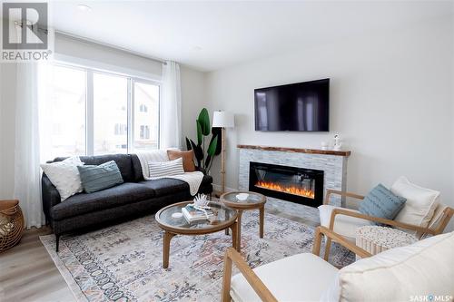 230 Schmeiser Bend, Saskatoon, SK - Indoor Photo Showing Living Room With Fireplace