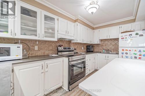 #103 -3040 Constitution Blvd, Mississauga, ON - Indoor Photo Showing Kitchen With Double Sink