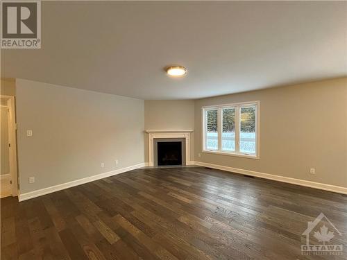 Living Room - with beautiful hardwood floors - 819 Solidex Place, Russell, ON - Indoor Photo Showing Other Room With Fireplace