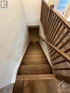 Hardwood staircase to the lower level - 