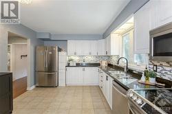 Kitchen with Granite Counter-top, Backsplash & SS Appliances - 