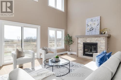 1080 Twamley Street W, North Perth, ON - Indoor Photo Showing Living Room With Fireplace