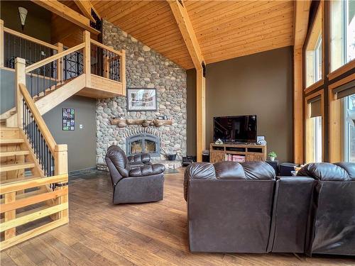 129 South Bay Drive, Onanole, MB - Indoor Photo Showing Living Room With Fireplace